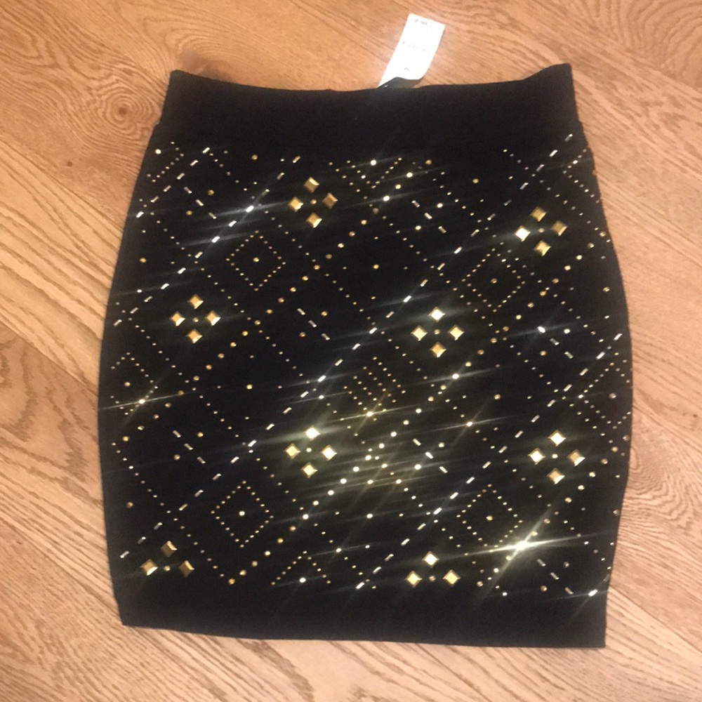 Bebe black studded mini skirt